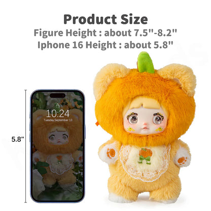Plush toy in pumpkin costume next to an iPhone 16, showing size comparison.Nommi V3 Interesting Fruit Dolls Series Dolls plush blind box — Orange (orange) — Kuwait — نومي
