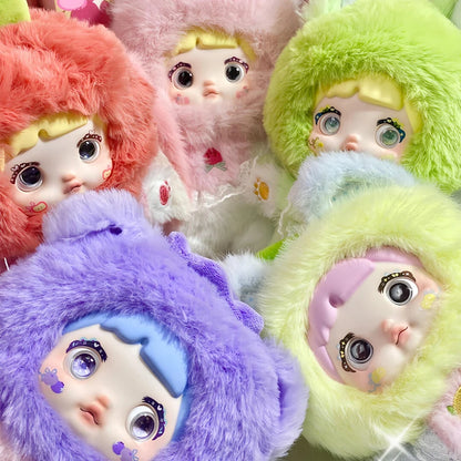 Colorful plush toys with large eyes and different colored fur. Nommi V3 Interesting Fruit Dolls Series Dolls plush blind box — all designs lineup (Strawberries, Lemon, Blueberry, Avocado, Orange, Apple, Toffee) — Kuwait — نومي