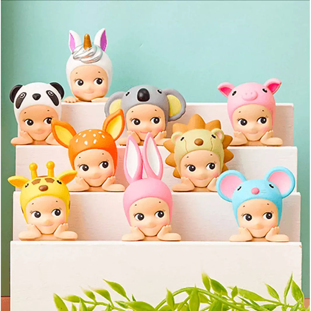 Set of colorful baby figurines with animal hats on a white stand against a light blue background. Sonny Angels Hippers Decorative Mini Figures blind box