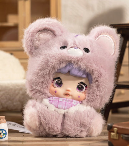 Plush toy with a hood resembling a bear, sitting on a surface. Nommi V4 Baby Series plush key chain blind box — Berry Baby (lavender/purple) — Kuwait — نومي — Maibo