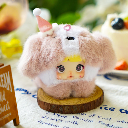 Small plush toy with a fluffy brown and white hood on a wooden base. Nommi V4 Baby Series plush key chain blind box — Cherry Baby (pink) — Kuwait — نومي — Maibo