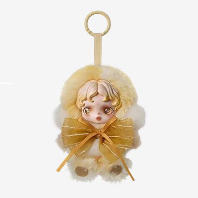 Decorative keychain with a small figurine wearing a yellow dress and bow on a white background, POPMART POP MART SKULLPANDA L’impressionnisme Series Plush blind box — Dawn (peach) — Kuwait — سكل باندا امبريشينزم - بوب مارت