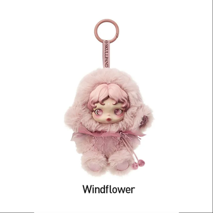 Pink doll-shaped keychain with fluffy details on a white background,POPMART POP MART SKULLPANDA L’impressionnisme Series Plush blind box — Windflower (pink) — Kuwait — سكل باندا امبريشينزم - بوب مارت