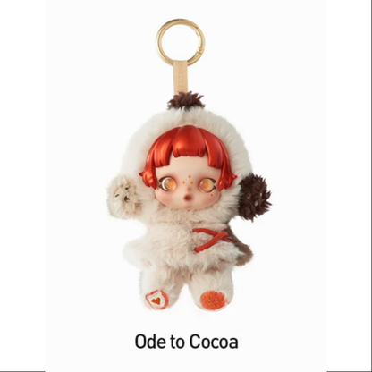 Small plush toy with red hair and white outfit on a white background , POP MART POP MART SKULLPANDA Winter Symphony Series Plush blind box — Ode to Cocoa (white) — Kuwait — سكل باندا ونتر سنفوني- بوب مارت
